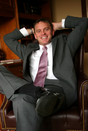 Leaning Back In Chair, Hands Behind Head
