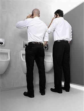 Men Talking Cellphones at Urinals