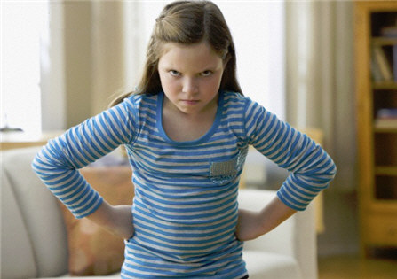 Angry Child With Hands on Hips